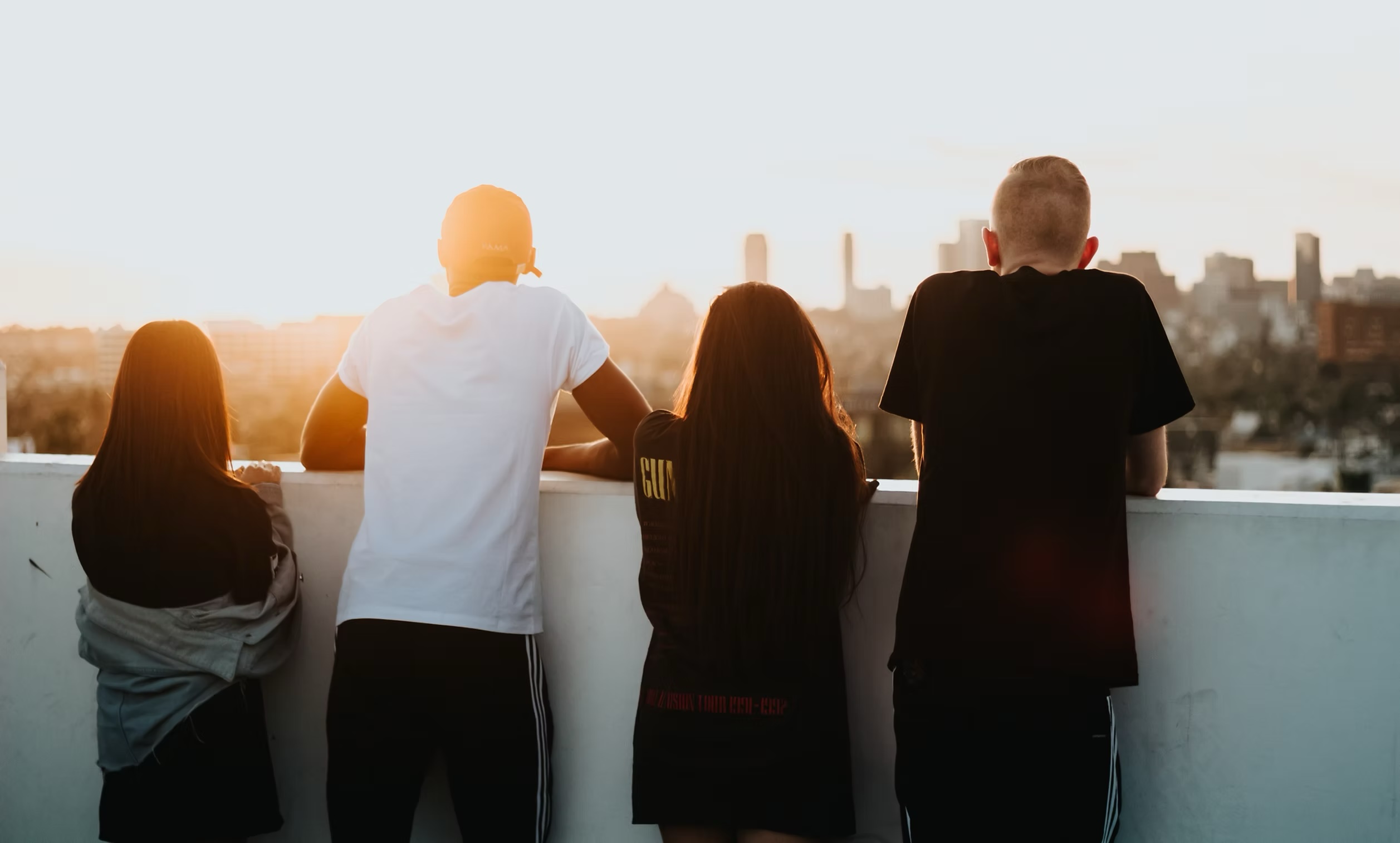 Youth overlooking city outdoors